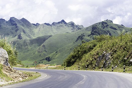 Long And Winding Rural Roads Leading Through Green Hills In Laos, The Route Between Vang Vieng - Luang Prabang