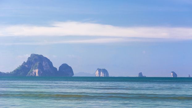 Wave of the sea on the sand beach, Beach and tropical sea, Paradise idyllic beach Krabi, Thailand, Summer holidays, Ocean in the evening as nature travel background.