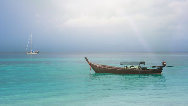 The Wooden Boat On Clear Blue Sea With Soft Light, Vintage Tone