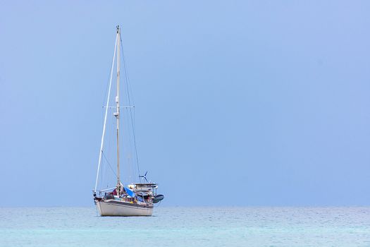 Alone Yacht Boat On Clear Blue Sea