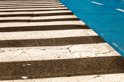 White painted pedestrian crossing on the road.