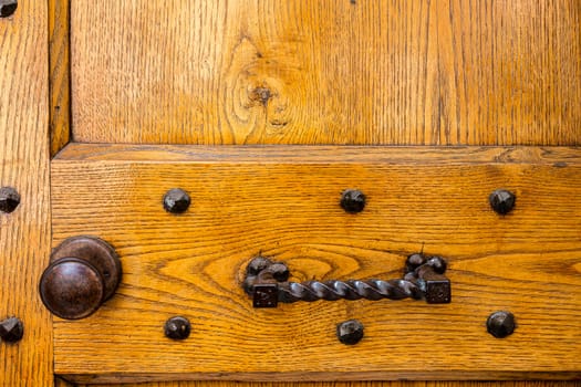 Close up of rustic old door in Spoleto, Italy.