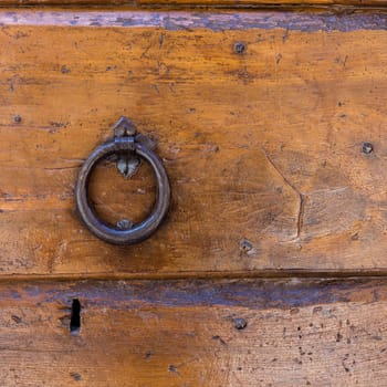 Close up of rustic old door in Spoleto, Italy.