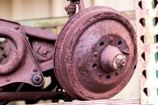 Rusty automotive brake drum and spindle with A-frames showing