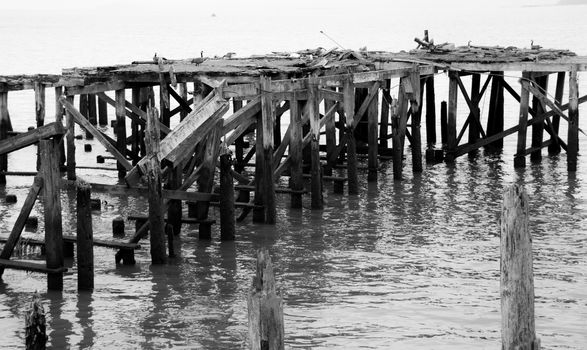 Dilapidated boat dock falling apart on the water