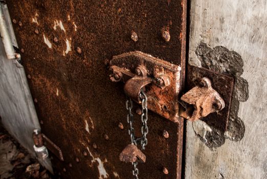 Rusty Iron door on a concrete wall