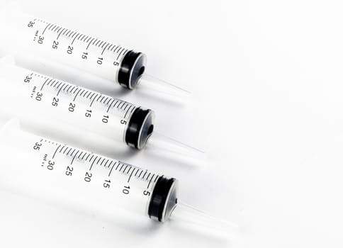 Industrial tapered tip syringes in a row side view