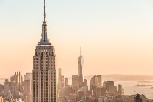 Golden sunset panoramic view of building and skyscrapers in Midtown and downtown skyline of lower Manhattan, New York City, USA.