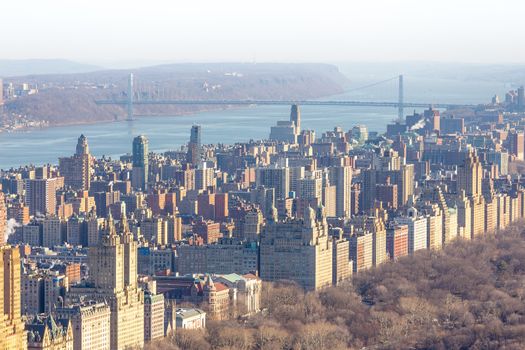 Panoramic elevated view of Central Park, Upper West Side and the George Washington Bridge with Hudson River in Fall. Manhattan, New York City, USA