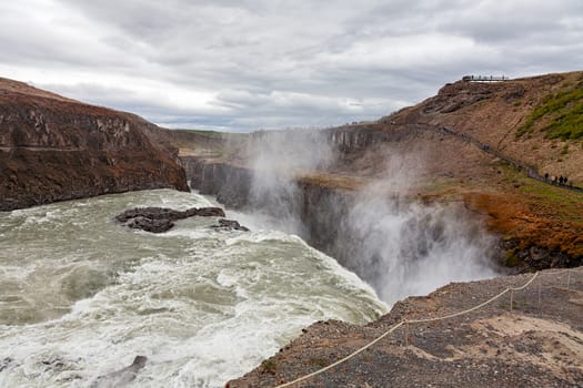 Panoramic view of powerful Gullfoss waterfall in a cloudy day, Iceland