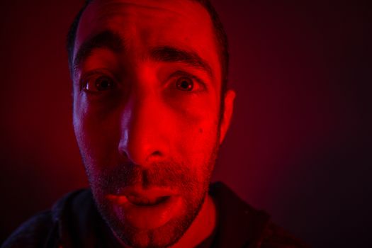 Man with surprised facial expression with opened mouth. Close up headshot portrait of shocked man
