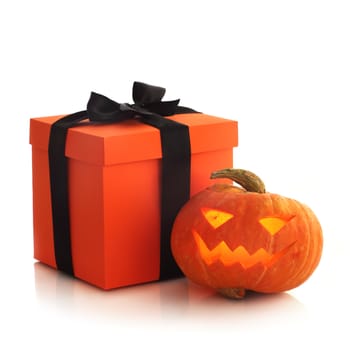 Halloween pumpkin and gift isolated on white background