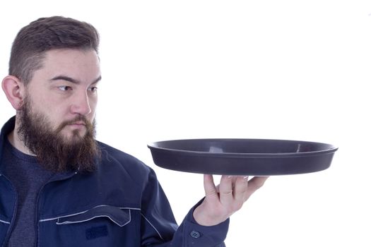 Bearded young man with a tray on a white background