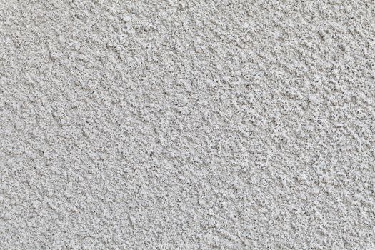 Macro texture of rough plaster covering of the building