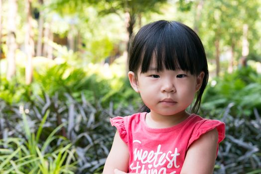 Portrait of beautiful asian child girl in outdoor park