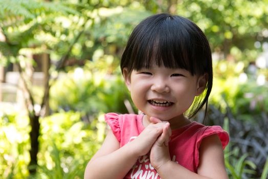 Portrait of beautiful asian child girl in outdoor park