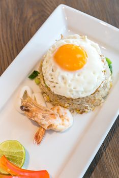 Seafood fried rice with squid and shrimp top with fried egg