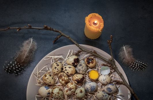 quail eggs in a plate on a dark background