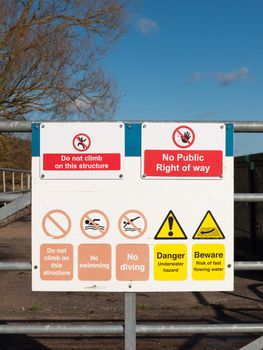 safety nature sign on locked metal gate do not climb this structure no public right of way warning; essex; england; uk