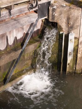 running splashing water from sluice nature mill outside down; essex; england; uk