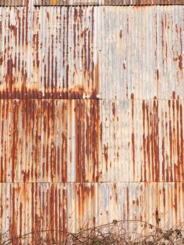 brown rusty dirty old retro metal corrugated iron shed background grunge industry; essex; england; uk