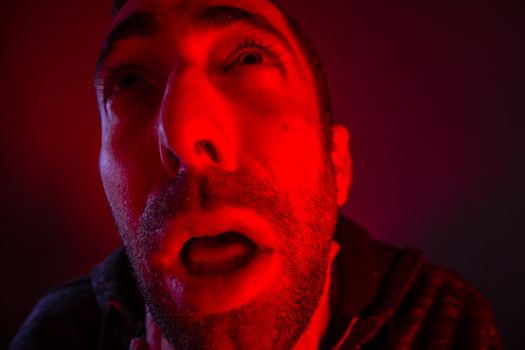 Depressed stressed man strangling himself. Close up headshot portrait of man chokes