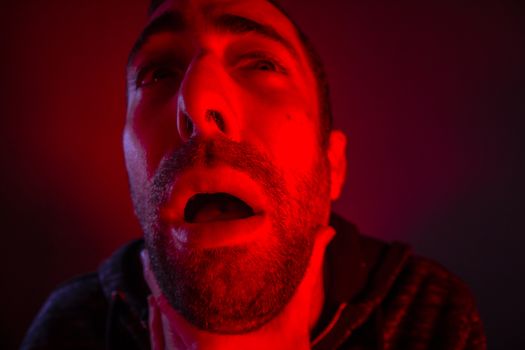 Depressed stressed man strangling himself. Close up headshot portrait of man chokes