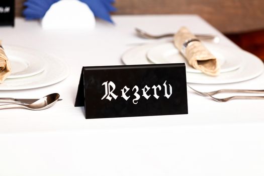 Closeup shot of restaurant reserved table sign