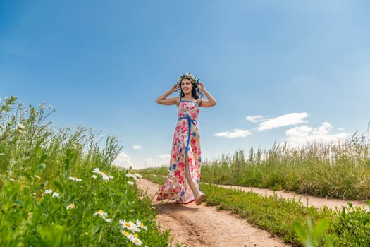 Portrait of the beautiful girl in the field to the utmost