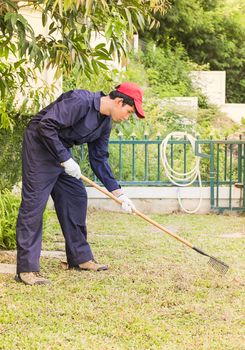 Young gardener with garden tools at work in home garden