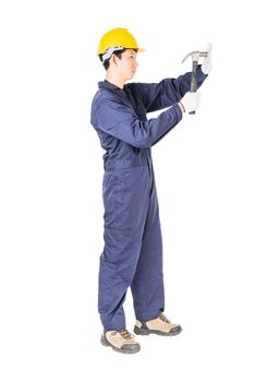 Young handyman in uniform standing with his hammer, Cutout isolated on white background