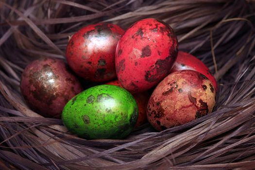 Red Easter egg in the hay