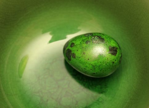 Green Easter Egg on Green Background