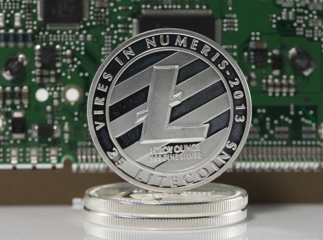 silver litecoin or ltc with computer print background