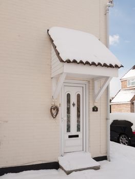 outside of house with snow on front porch covered; essex; england; uk