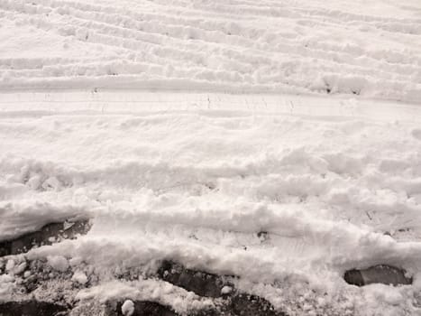 surface full view of snow on ground with footsteps texture winter; essex; england; uk