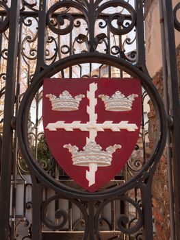 colchester shield sign emblem on gates red and black town park; essex; england; uk