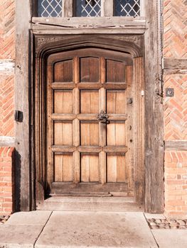 close up of old medieval brown wooden retro door closed; essex; england; uk