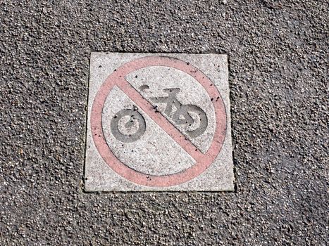 no cycling sign on pavement park floor red circle restriction icon; essex; england; uk