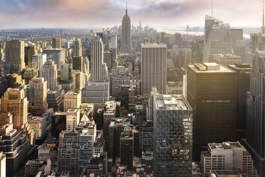 New York City skyline with urban skyscrapers at sunset, USA.