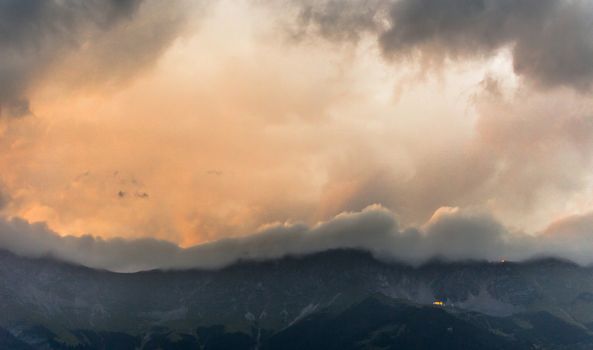 Sunset behind the mountains at the Austrian Alps