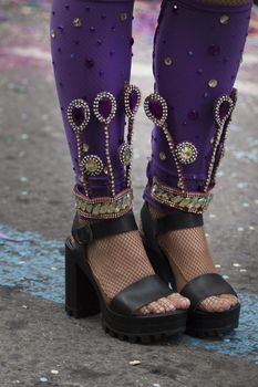 Legs of a colorful Carnival (Carnaval) Parade festival female participant