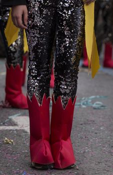 Legs of a colorful Carnival (Carnaval) Parade festival  participant.