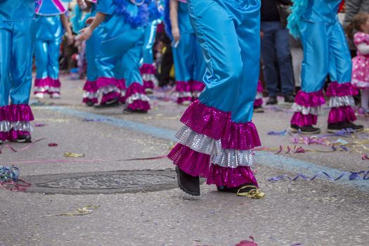 Legs of a colorful Carnival (Carnaval) Parade festival female participant