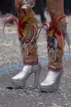 Legs of a colorful Carnival (Carnaval) Parade festival female participant