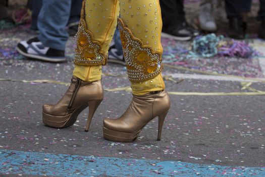 Legs of a colorful Carnival (Carnaval) Parade festival female participant