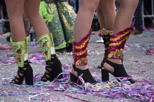 Legs of a colorful Carnival (Carnaval) Parade festival female participant