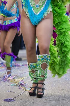 Legs of a colorful Carnival (Carnaval) Parade festival female participant