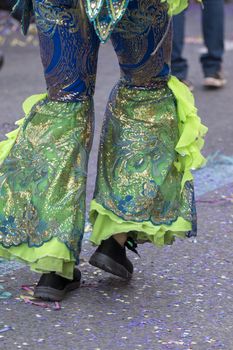 Legs of a colorful Carnival (Carnaval) Parade festival female participant