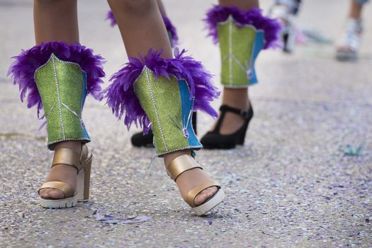 Legs of a colorful Carnival (Carnaval) Parade festival female participant